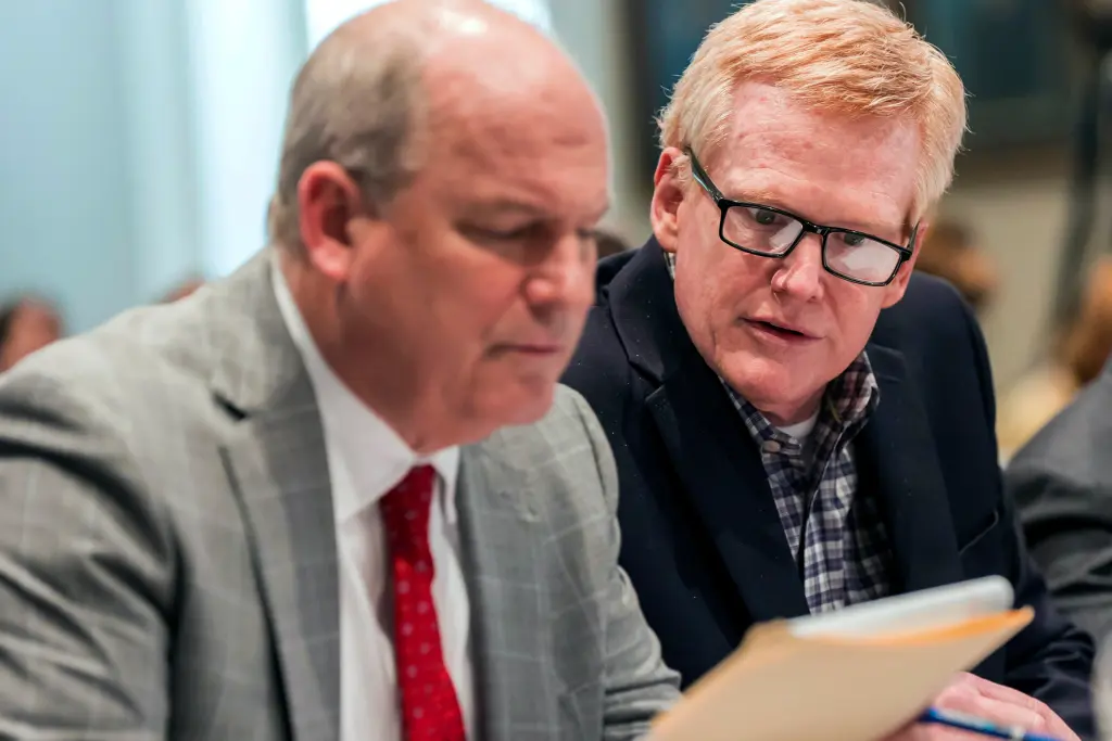 Murdaugh confers with his lawyer Jim Griffin during his double murder trial.