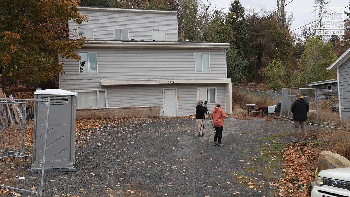 Investigators set up outside the home where four University of Idaho students were slain in November last year