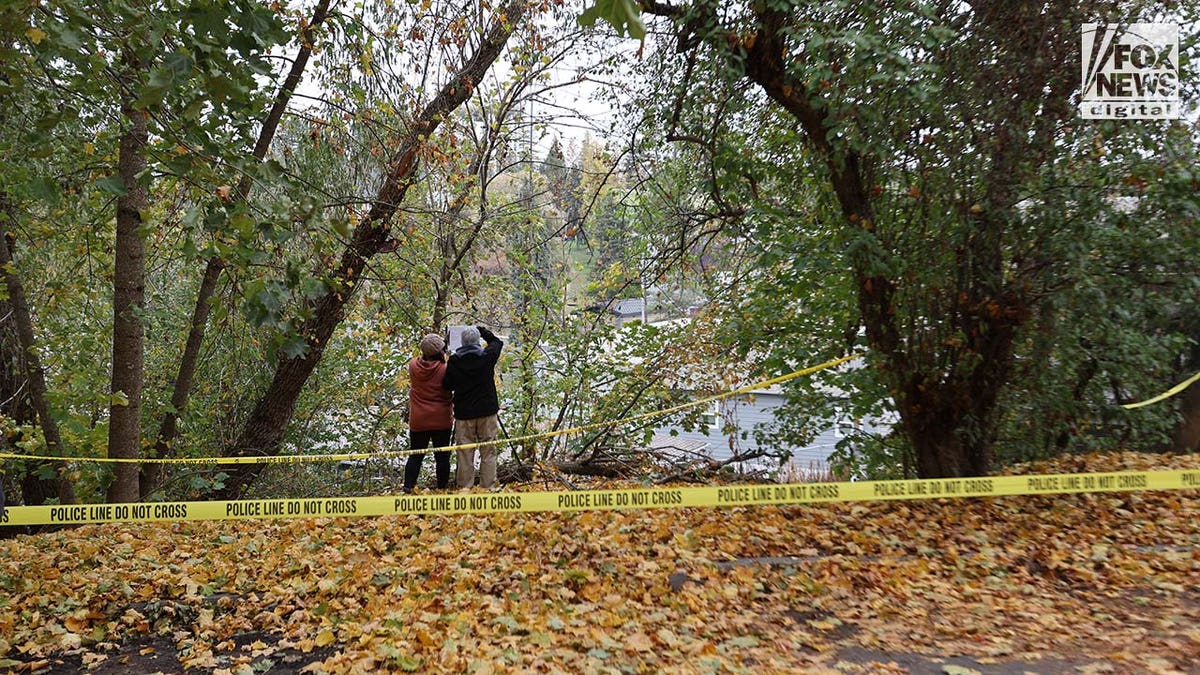 Investigators set up outside the home where four University of Idaho students were slain in November last year