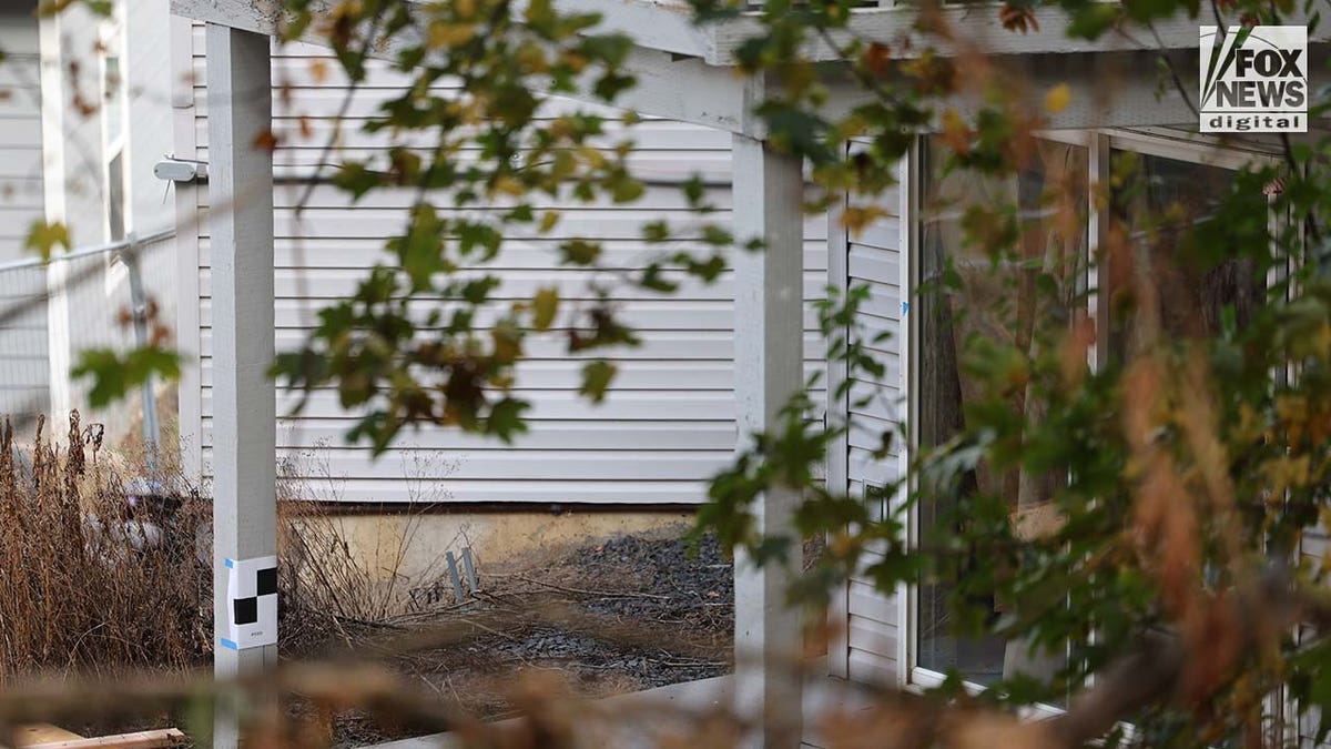 A clean wall where staining was once visible is seen outside the home where four University of Idaho students were slain in November last year