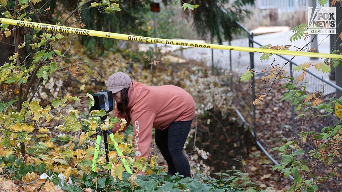 Investigators set up outside the home where four University of Idaho students were slain in November last year