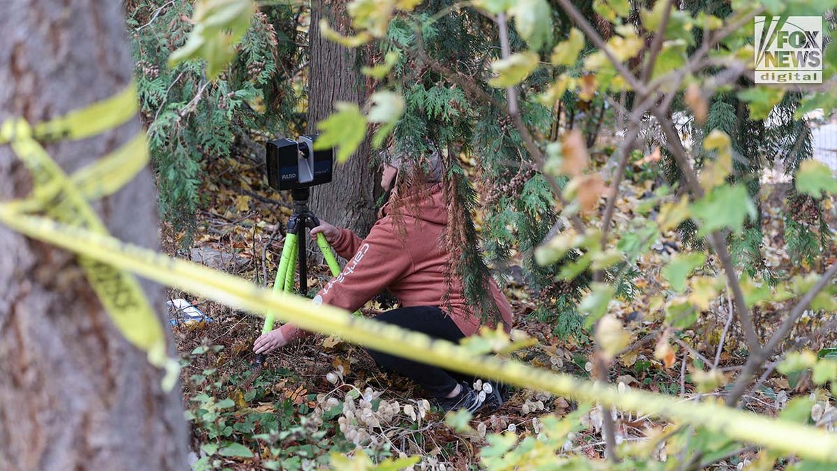 Investigators set up outside the home where four University of Idaho students were slain in November last year