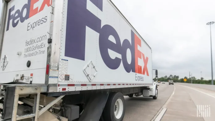 FedEx tumbles after slashing full-year sales forecast in volatile economy