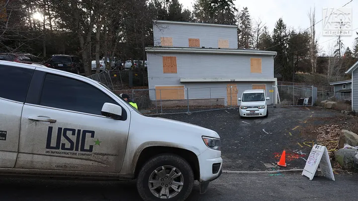 Utility workers inspect the house where four University of Idaho students were fatally stabbed in Moscow, Idaho,