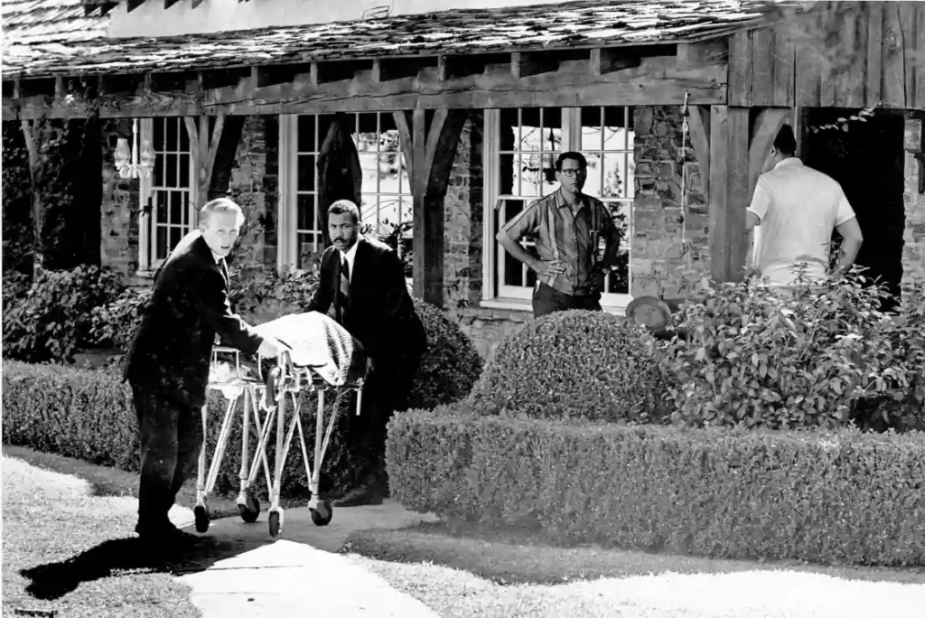 The body of Sharon Tate is taken from her home on Cielo Drive after she and four others were found murdered by Charles Manson and his cult followers.