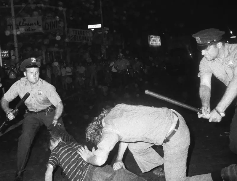 In This Aug. 31,1970 File Photo, An Nypd Officer Grabs A Youth By The Hair As Another Officer Clubs A Young Man During A Confrontation In Greenwich Village After A Demonstration March In New York.